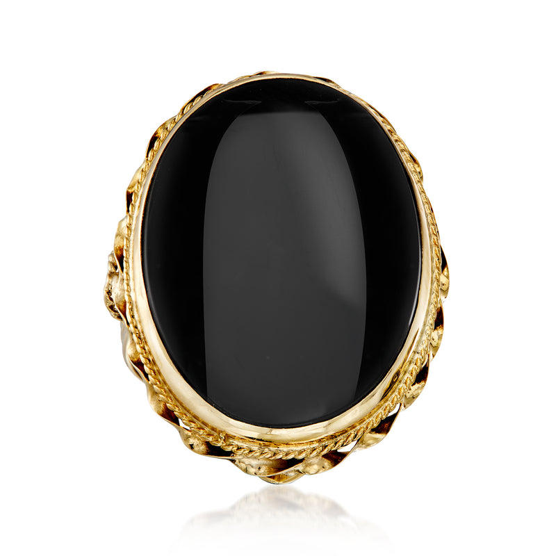Vintage oval onyx cabochon ring in 14kt yellow gold with ornate gold shoulders