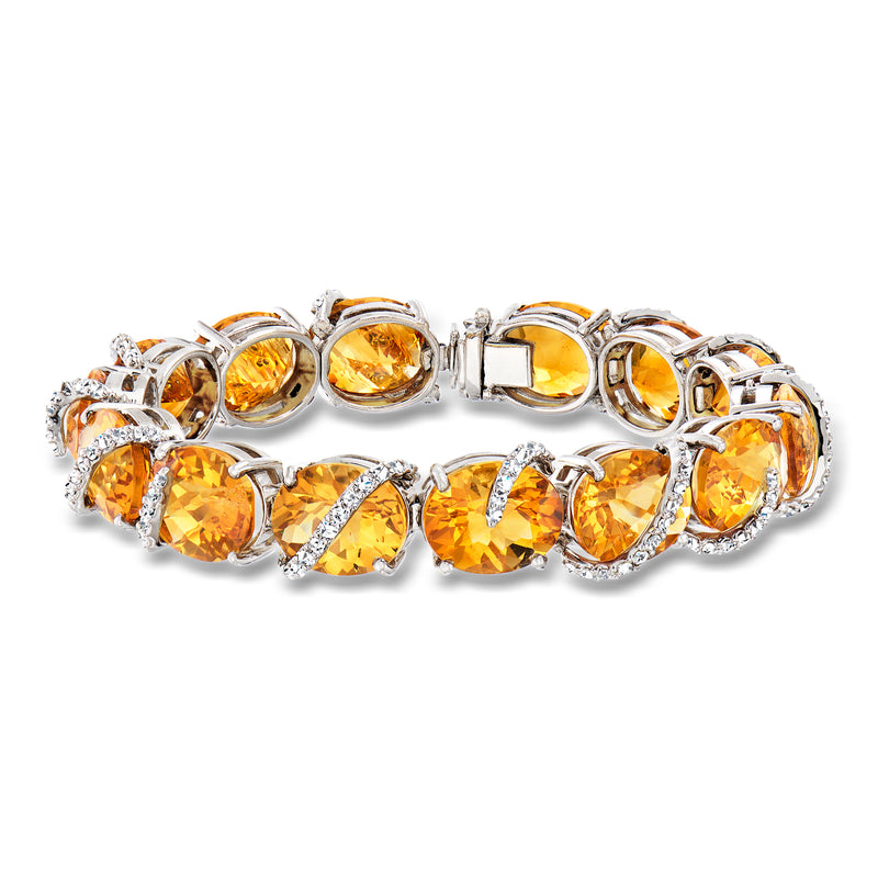 White gold link bracelet with oval citrine stones and round diamonds, hinged clasp