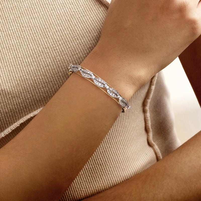 Diamond bangle bracelet with marquise link settings worn on wrist