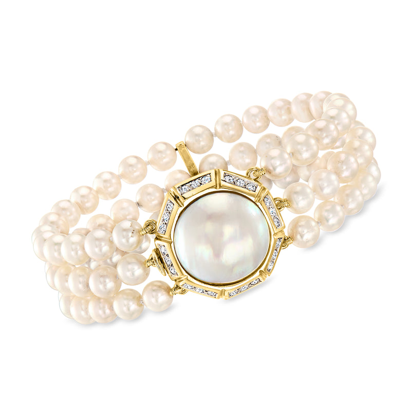 Cultured pearl bracelet with round mabe pearl center set in diamond bezel, 14kt gold