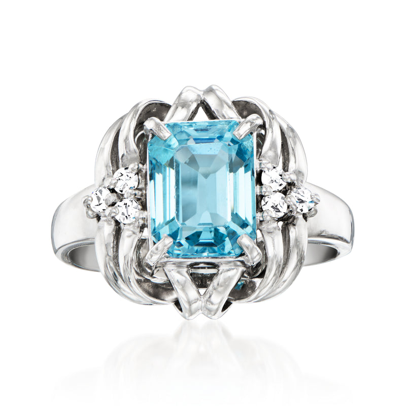 Platinum ring with rectangular sky-blue topaz center and diamond accents