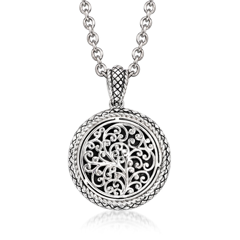 Sterling silver round pendant necklace with ornate filigree and black enamel inset
