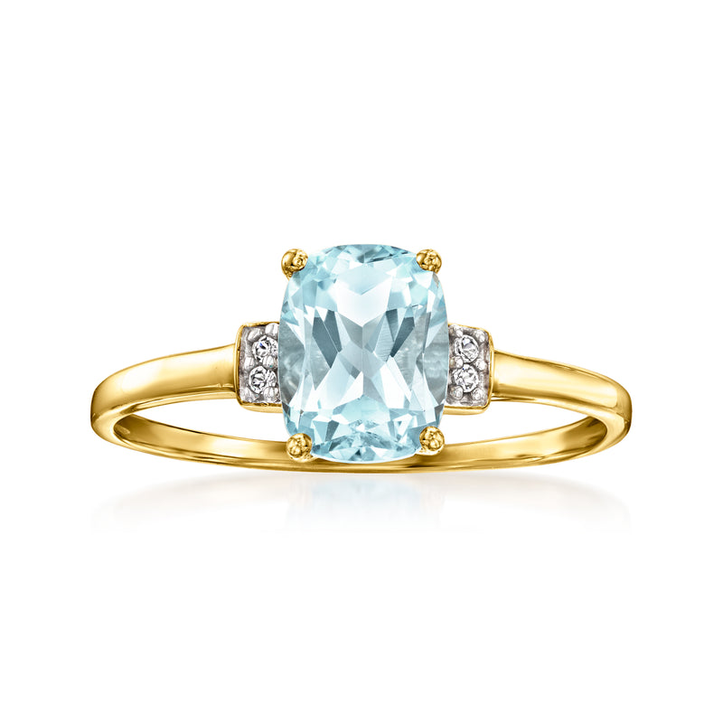 10kt yellow gold ring with oval sky-blue topaz center and four white topaz accents