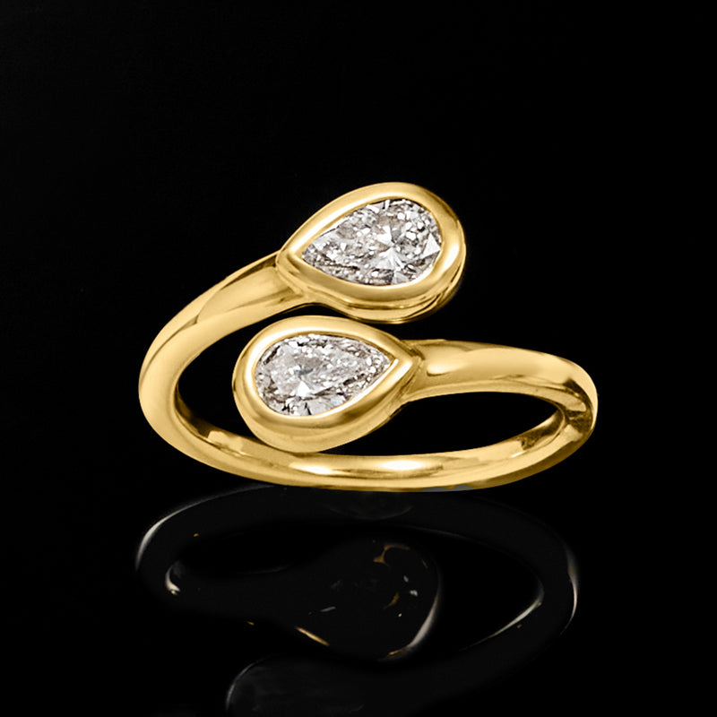 14kt yellow gold bypass ring with two oval lab-grown diamonds, angled top view