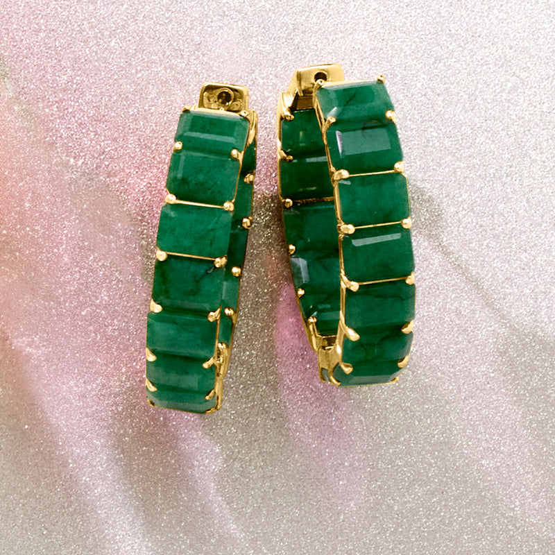 Gold hoop earrings with stacked emerald-green rectangular stones, close-up side view