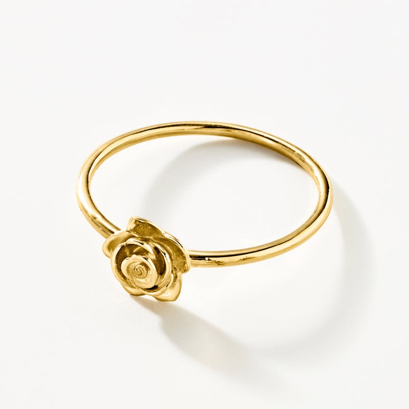 Yellow gold rose ring with rose motif at band edge, slim profile