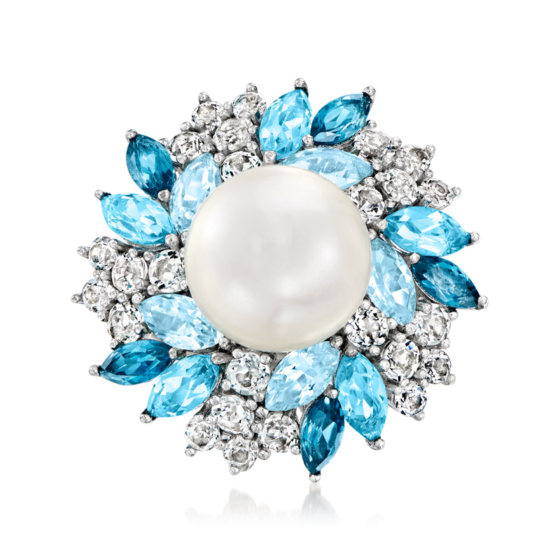 Sterling silver ring with large white pearl center and blue gemstone halo