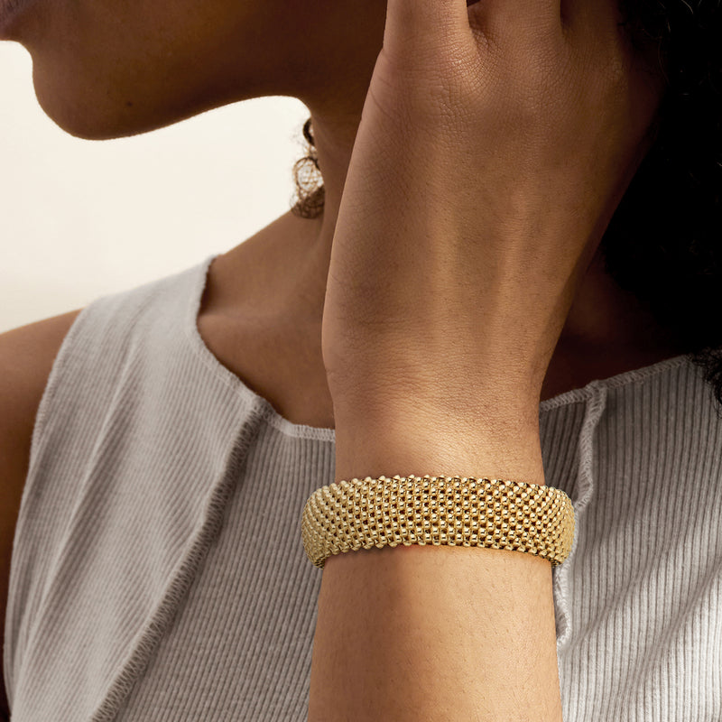 Gold over sterling popcorn-chain mesh cuff bracelet on wrist, open cuff design