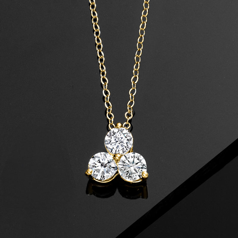 Yellow gold lab-grown diamond trio pendant on a linked chain, three round stones