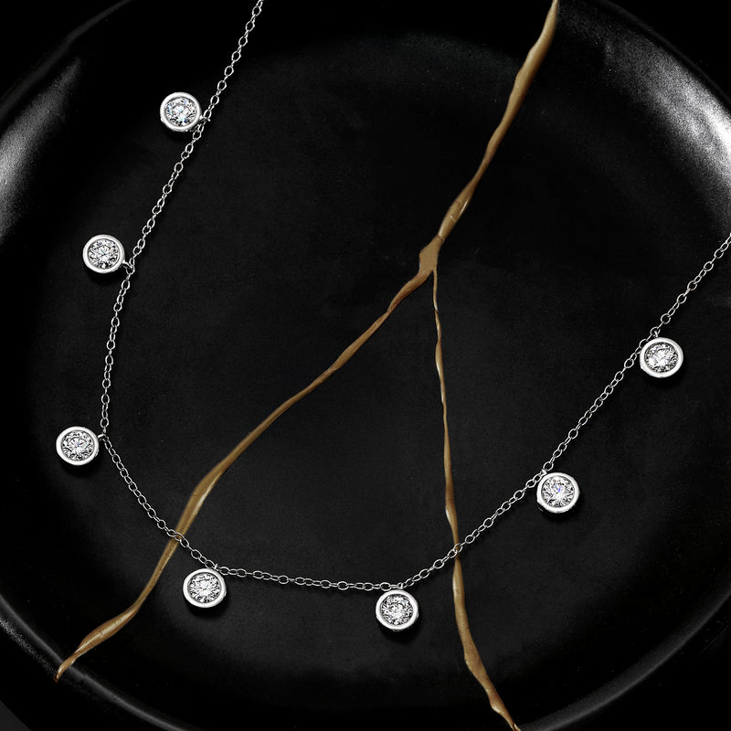 14kt white gold diamond dangle station necklace with five round lab-grown diamonds on tray