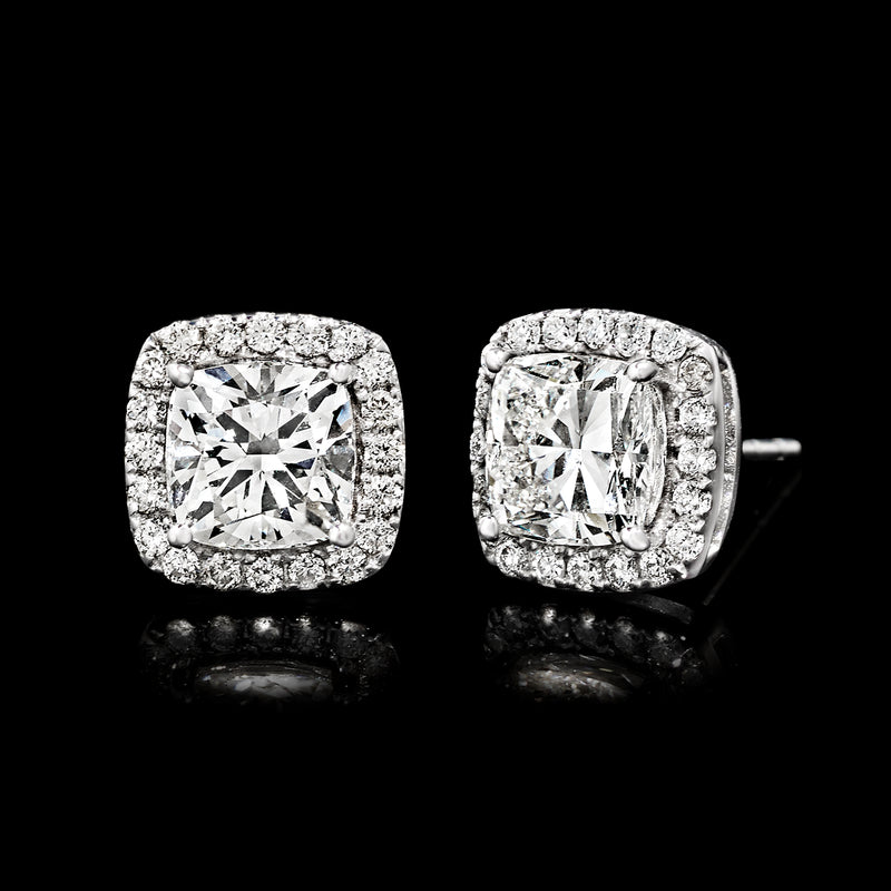 Cushion-cut diamond stud earrings with post backs, halo setting in white gold