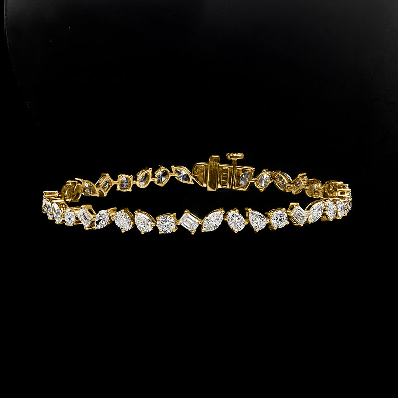 14kt yellow gold diamond tennis bracelet with hinged clasp and multi-shaped stones