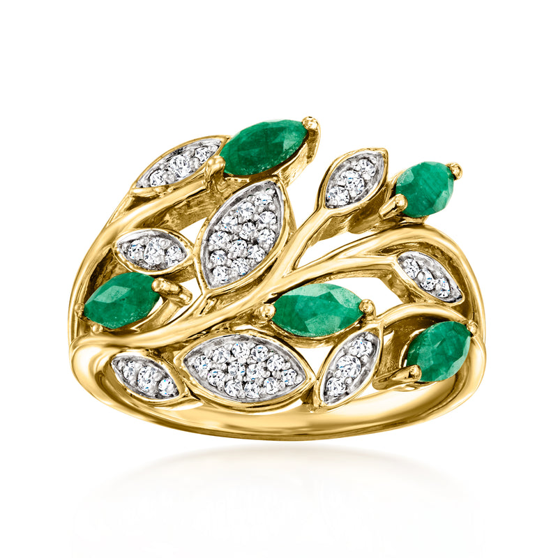 Gold leaf ring with oval green stones and white crystal leaf accents.