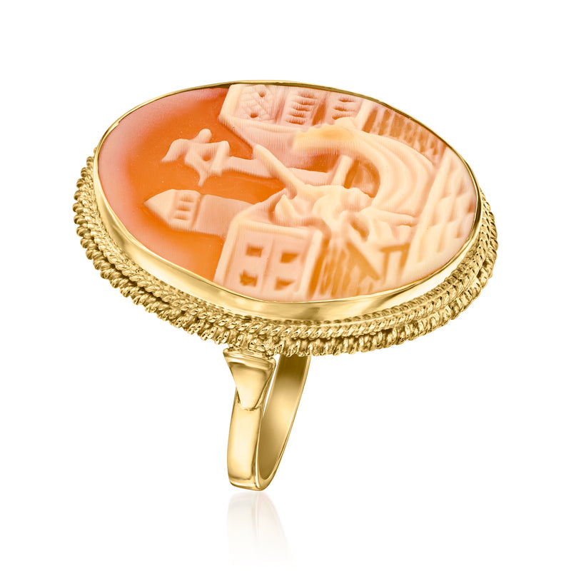 Orange shell cameo ring with gold-tone edge and gondola cameo detail