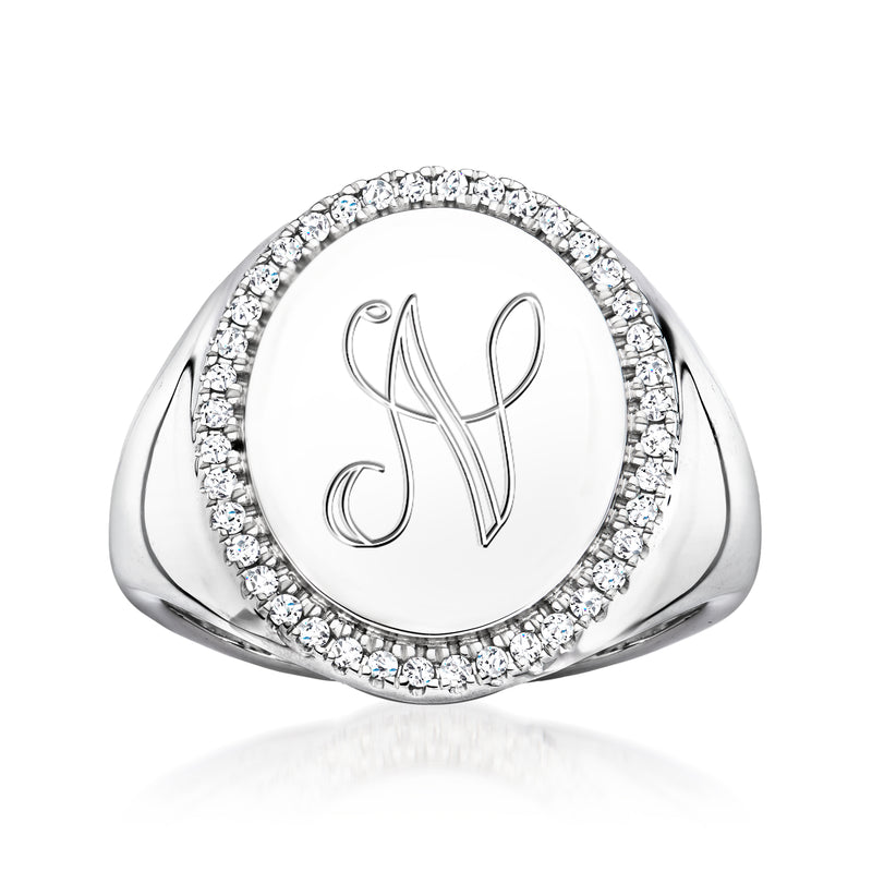Sterling silver personalized diamond ring with round halo and engraved monogram.