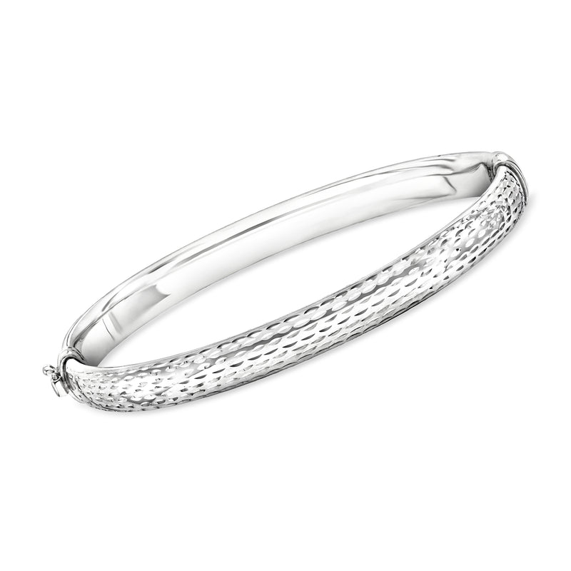 Sterling silver diamond-cut bangle bracelet with textured clasp ends