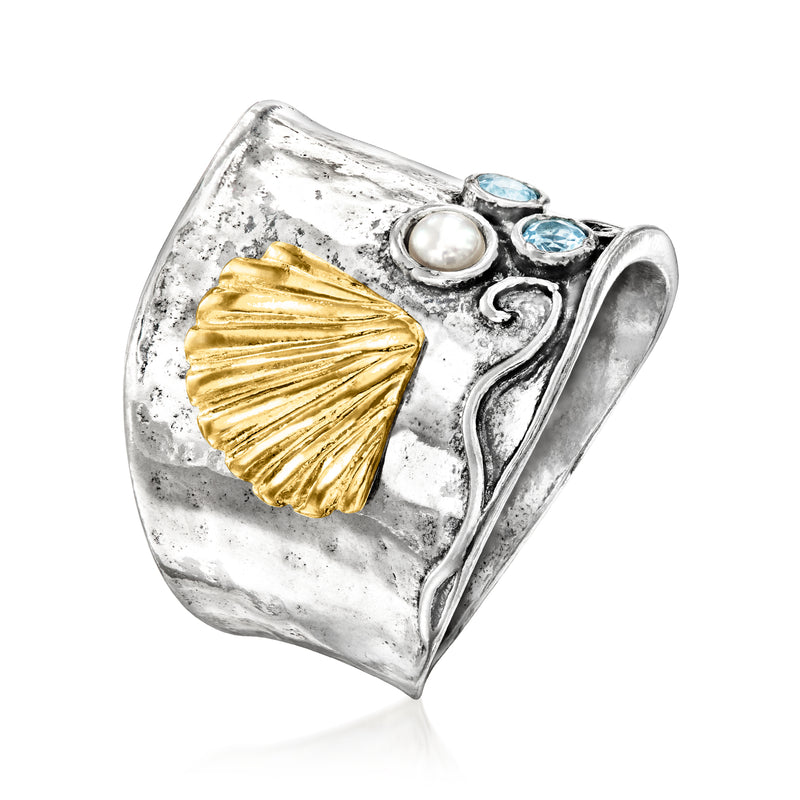 Side view of hammered seashell ring in sterling silver with gold shell, pearl, blue stones