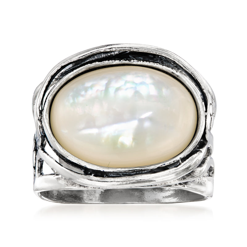Sterling silver ring with oval mother-of-pearl cabochon and scalloped bezel
