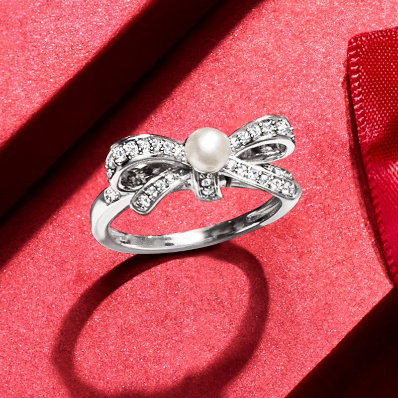Sterling silver bow ring with cultured pearl and diamond accents