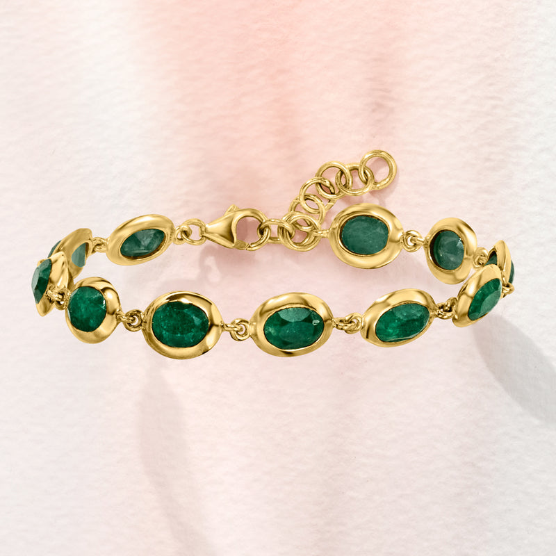 Gold-tone bracelet with oval green gemstones and small round link chain