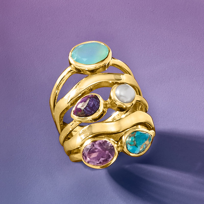 Gold over sterling ring with oval aqua top stone, white pearl, purple and turquoise side stones.