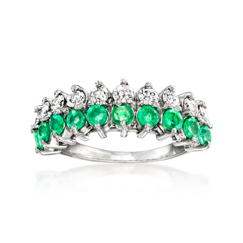 Vintage emerald and diamond ring in platinum, green gemstones with sparkling diamond accents.