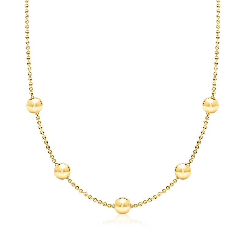 Gold bead station necklace with small round stations and polished round bead accents