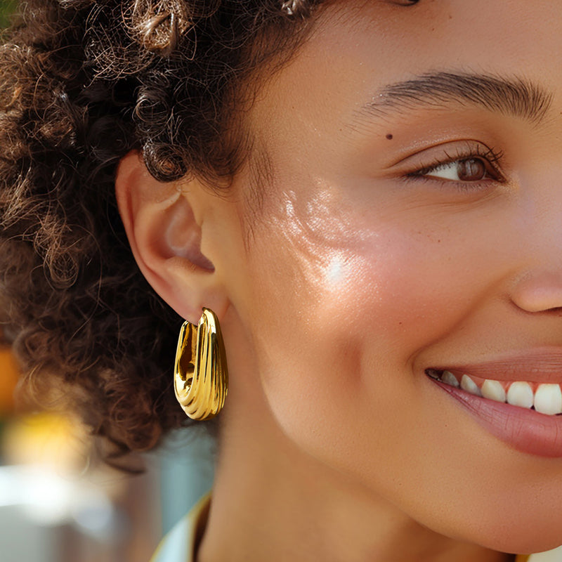Yellow gold ribbed hoop earring, large rounded hoop with hinged post