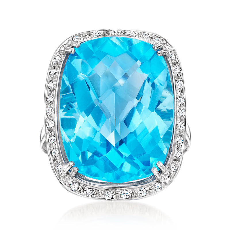 Cushion-cut blue topaz diamond halo ring in 14kt white gold