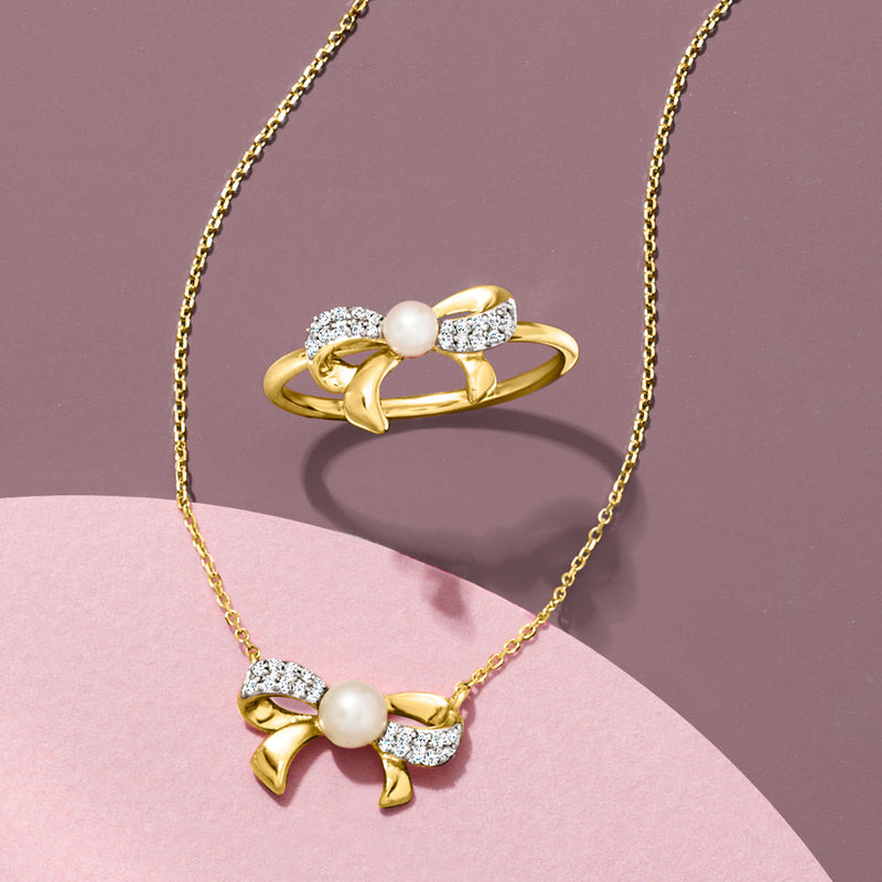 Cultured pearl bow ring and necklace with diamonds in yellow gold
