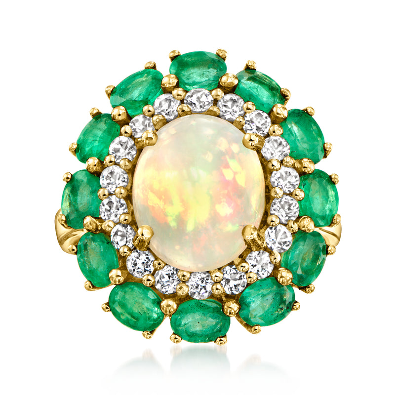 Opal cabochon gemstone ring with emerald-green stones and white accents, gold-tone setting