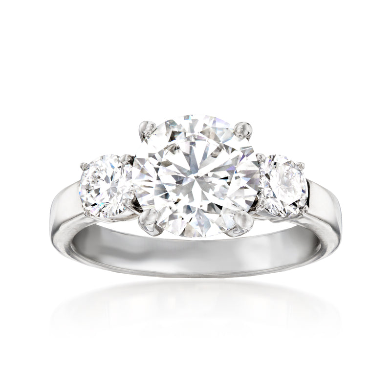 14kt white gold three-stone diamond ring with large center and two side stones