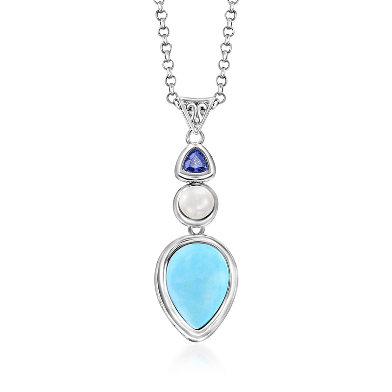 Sterling silver pendant necklace with blue teardrop stone, white pearl, and larimar drop