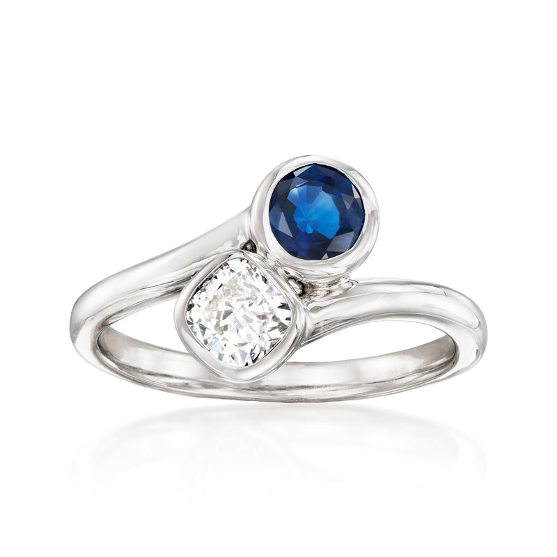 14kt white gold bypass ring with round blue sapphire and round diamond