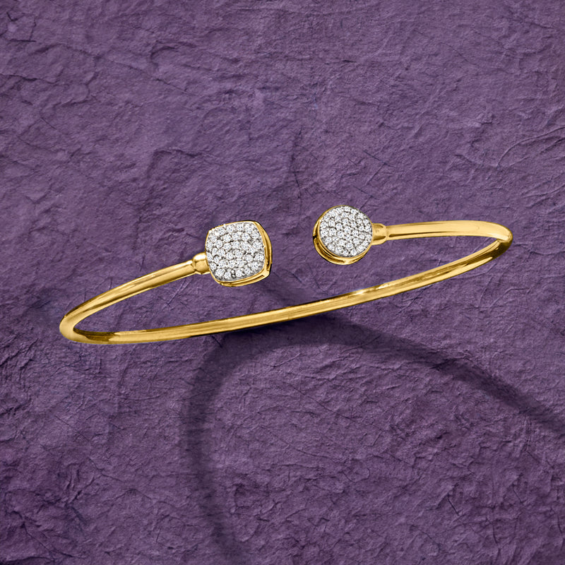 Gold cuff bracelet with square and round diamond clusters