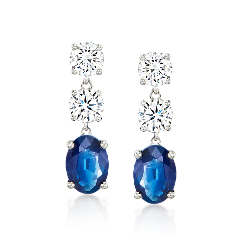Sapphire and diamond drop earrings in white gold, oval blue stone with prong setting
