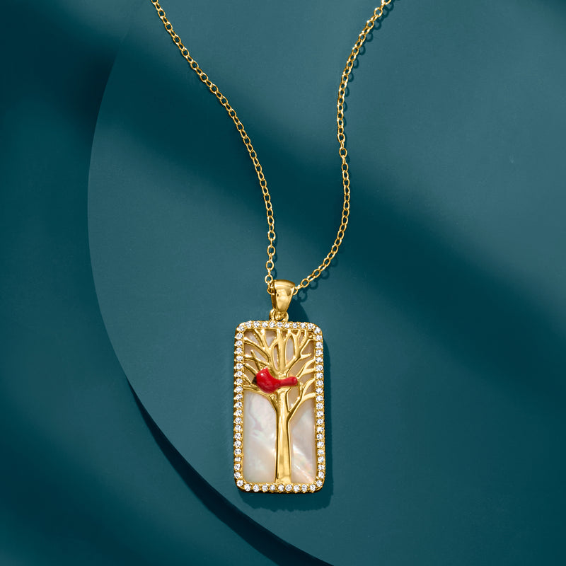 Gold pendant necklace with rectangular pendant, red cardinal on gold tree, stone border