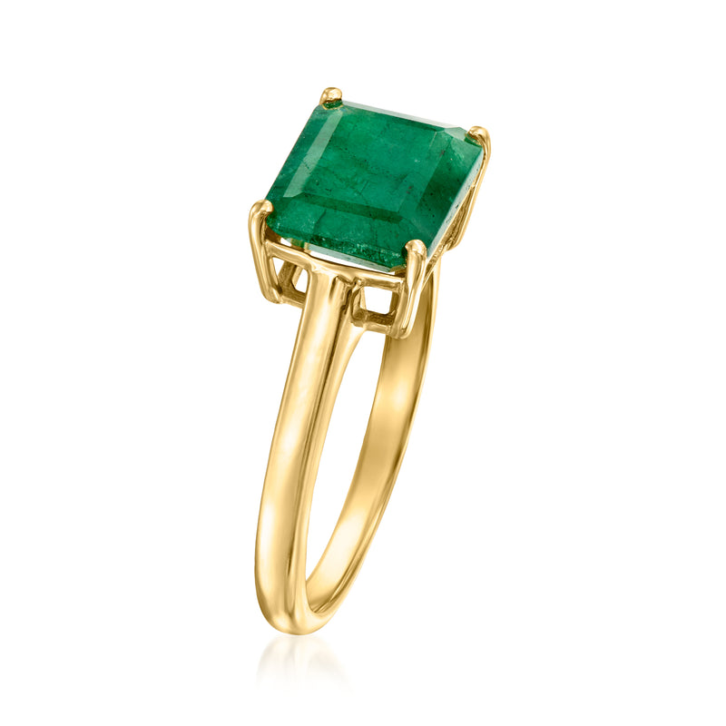 Gold ring with emerald-green rectangular gemstone, side view