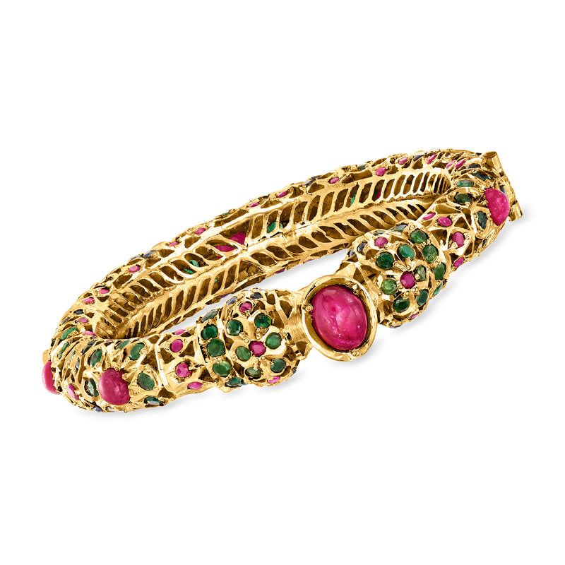 Gold-filled bangle bracelet with multicolor gemstones and pink oval centerpiece