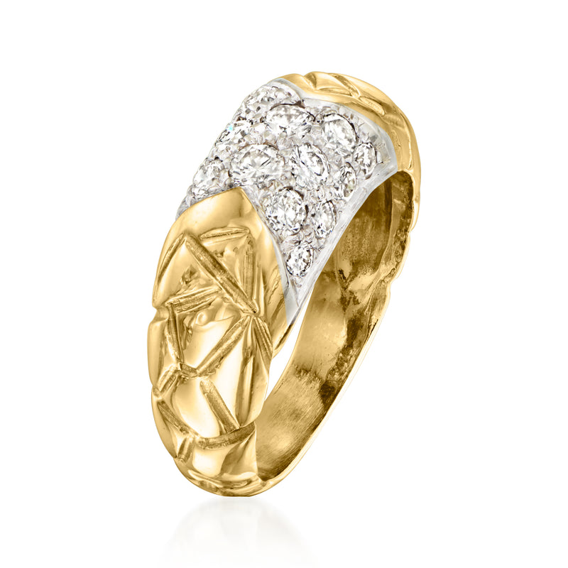 Yellow gold diamond cluster ring with raised setting and engraved side details.