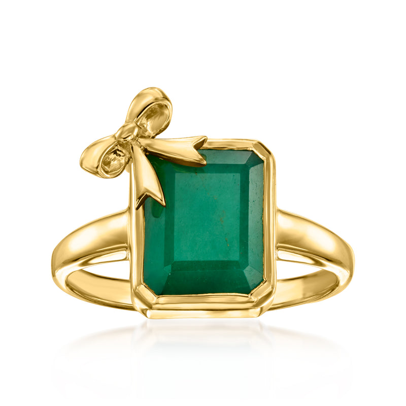 Gold bow ring with emerald-cut green gemstone center and open band detail