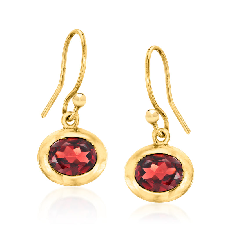 Gold drop earrings with deep red round gemstone in a halo-style setting