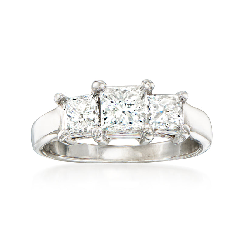 14kt white gold three-stone diamond ring with rectangular-cut center and side stones