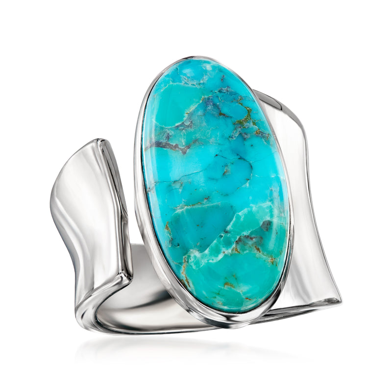 Sterling silver wrap ring with oval turquoise cabochon, sculpted open sides