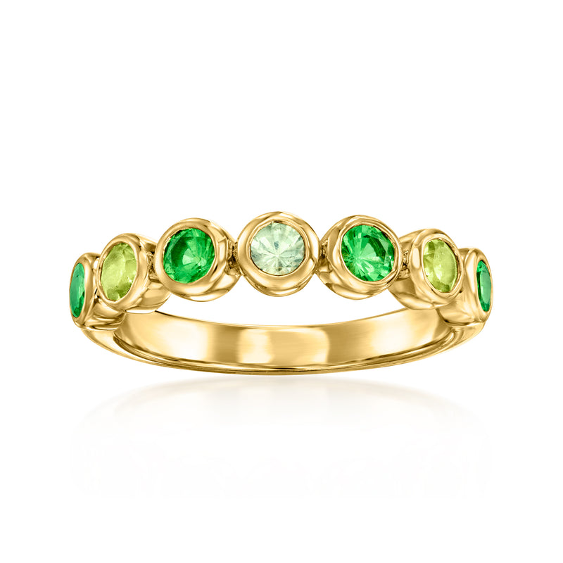 Gold over sterling ring with alternating green gemstones and oval halos, domed band