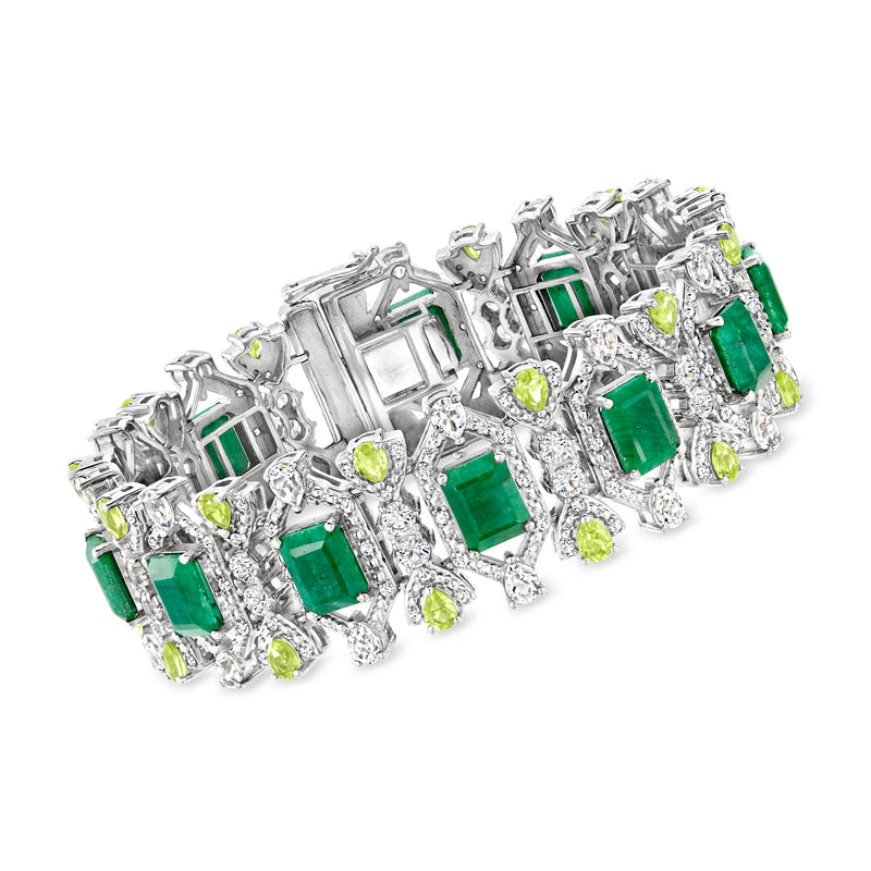 Sterling silver tennis bracelet with green emerald-style and peridot stones and clear accents