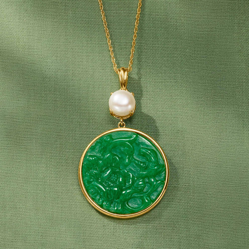 Gold-toned necklace pendant with green jade round disc and white pearl top