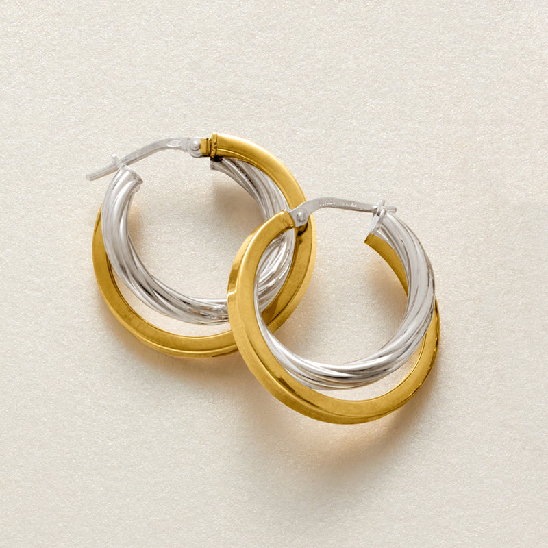 Two-tone double hoop earrings, gold and silver finish with stud closure