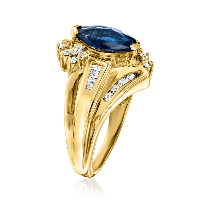 Yellow gold ring with blue oval sapphire, baguette and round diamond side stones