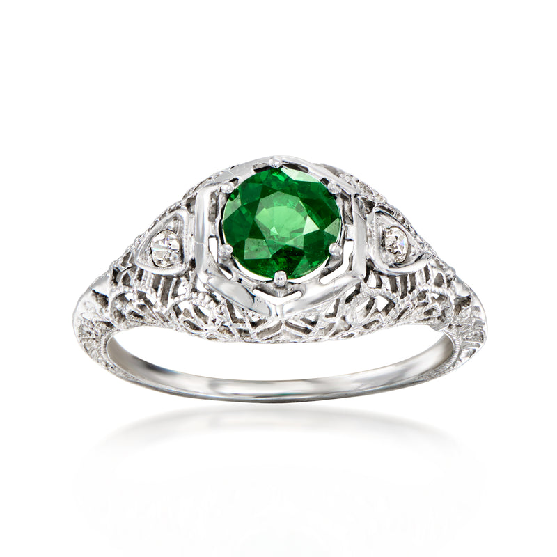 Vintage 18kt white gold ring with green tsavorite center, diamond accents, filigree.